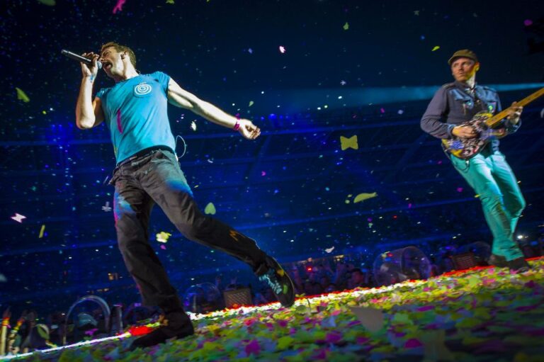 Coldplay performing with colorful confetti